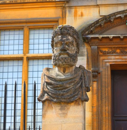 Photo for OXFORD, UNITED KINGDOM 06 20 2023: In front of the Sheldonian Theatre and History of Science Museum sit 17 stone heads depicting bearded man, generally known as the Emperors' Heads - Royalty Free Image