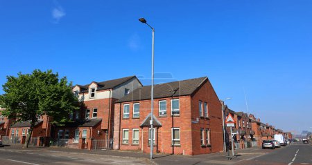 Foto de BELFAST NORTHERN IRELAND UNITED KINGDOM 06 03 2023: Belfast's traditional red brick Victorian Terraced houses in being flattened for bland housing with little merit - Imagen libre de derechos