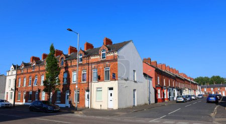 Foto de BELFAST NORTHERN IRELAND UNITED KINGDOM 06 03 2023: Belfast's traditional red brick Victorian Terraced houses in being flattened for bland housing with little merit - Imagen libre de derechos