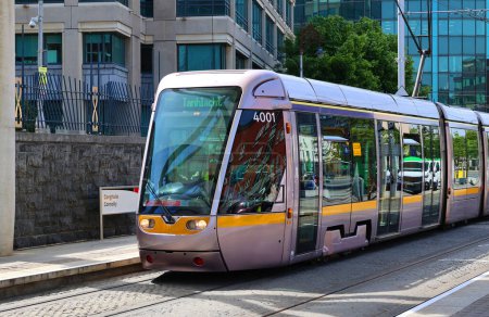 Photo for DUBLIN REPUBLIC OF IRELAND 05 28 2023: Luas Tram system in Dublin, Ireland. There are two main lines: the Green Line, which began operating on 30 June 2004, and the Red Line which opened in 2004 - Royalty Free Image