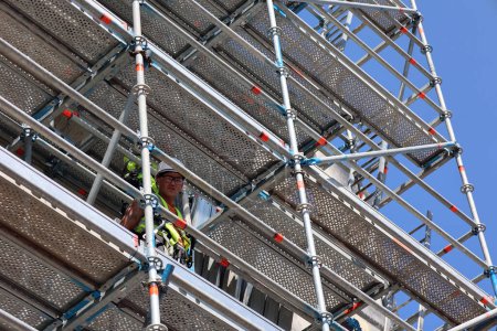 Photo for DUBLIN REPUBLIC OF IRELAND 05 28 2023: Young worker on scaffold - Royalty Free Image