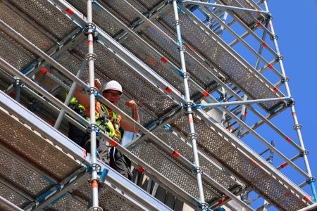 Photo for DUBLIN REPUBLIC OF IRELAND 05 28 2023: Young worker on scaffold - Royalty Free Image