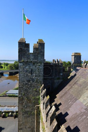 Photo for BUNRATTY IRELAND 05 29 2023: Bunratty Castle (Irish: CaisleAn Bhun Raithe, meaning "castle at the mouth of the Ratty") is a large 15th-century tower house in County Clare, Ireland. - Royalty Free Image