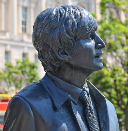 Photo for LIVERPOOL UNITED KINGDOM 06 07 20: Statue of John Lennon on Liverpool's Waterfront in 2015. Donated by the famous Cavern Club, the placement of the statue coincides with the 50 year anniversary band - Royalty Free Image