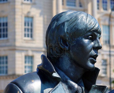 Photo for LIVERPOOL UNITED KINGDOM 06 07 20: Statue of John Lennon on Liverpool's Waterfront in 2015. Donated by the famous Cavern Club, the placement of the statue coincides with the 50 year anniversary band - Royalty Free Image