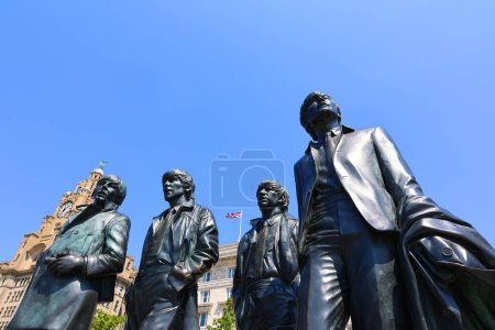 Photo for LIVERPOOL UNITED KINGDOM 06 07 20 Beatles Statue arrived on Liverpool's Waterfront in 2015. Donated by the famous Cavern Club, the placement of the statue coincides with the 50 year anniversary - Royalty Free Image