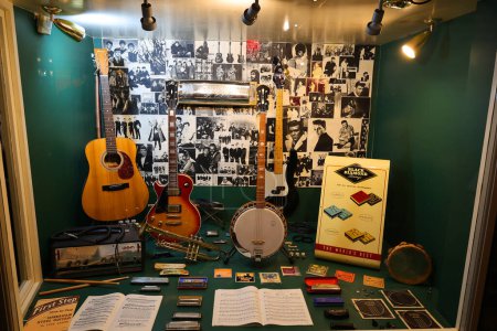 Photo for LIVERPOOL UNITED KINGDOM 06 07 2023: Music instruments at The Beatles Story is a museum in Liverpool about the Beatles and their history. It is located on the historical Royal Albert Dock - Royalty Free Image