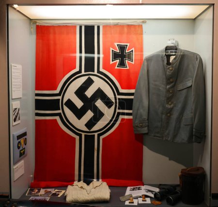 Photo for LIVERPOOL UNITED KINGDOM 06 07 2023: Wehrmacht were the unified armed forces of Nazi Germany from 1935 to 1945. Kriegsmarine (navy) uniform and Wehrmacht flag - Royalty Free Image