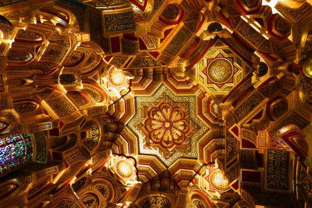 Photo for LIVERPOOL UNITED KINGDOM 06 07 2023: The Arab Room Cardiff castle. The ceiling is of a style known as a muquarnas, it is made of wood which has been covered in gold leaf and decorated - Royalty Free Image