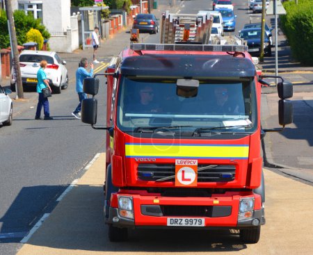 Photo for BELFAST NORTHERN IRELAND UNITED KINGDOM 06 03 2023: Firefighter truck Northern Ireland Fire and Rescue Service sits at the heart of the Northern Ireland community, focused on keeping us safer - Royalty Free Image