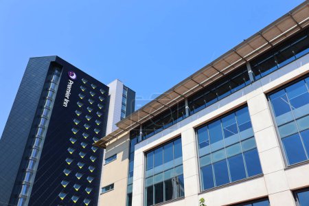 Photo for CARDIFF WALES UNITED KINGDOM 06 17 23: Premier Inn Cardiff. The buildings unfinished black cladding has become a prominent addition to the city centres skyline - Royalty Free Image