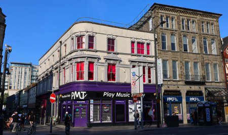 Photo for CARDIFF WALES UNITED KINGDOM 06 17 23: Play music today, PMT Cardiff is unlike any other music shop. The store is a true 'House of Rock', filled with the latest guitars, bass guitars, amplifiers, ect. - Royalty Free Image
