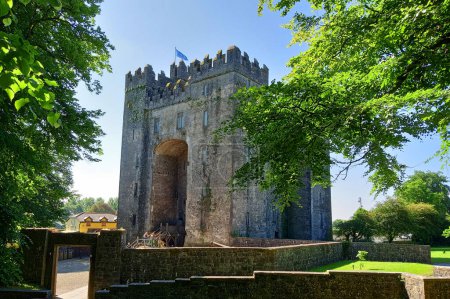 Photo for BUNRATTY IRELAND 05 29 2023: Bunratty Castle (Irish: CaisleAn Bhun Raithe, meaning "castle at the mouth of the Ratty") is a large 15th-century tower house in County Clare, Ireland. - Royalty Free Image
