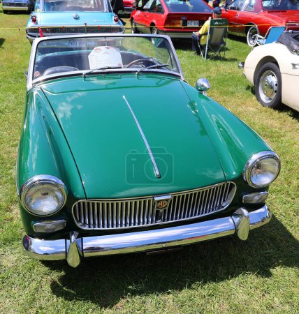 Photo for GRANBY QUEBEC CANADA 07 30 2023: MG Midget is a small two-seater lightweight sports car produced by MG from 1961 to 1979. It revived a name that had been used on earlier models such as the MG M-type - Royalty Free Image