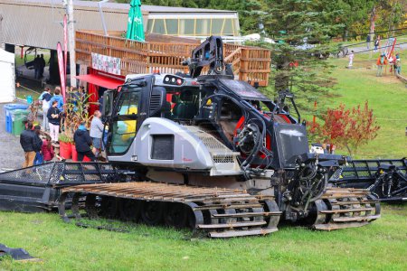 Photo for SUTTON QUEBEC CANADA 01 10 2023: Snow grooming is the process of manipulating snow for recreational uses with a tractor, snowmobile, piste caterpillar, truck or snowcat towing specialized equipment. - Royalty Free Image