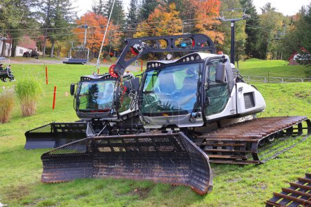 Photo for SUTTON QUEBEC CANADA 01 10 2023: Snow grooming is the process of manipulating snow for recreational uses with a tractor, snowmobile, piste caterpillar, truck or snowcat towing specialized equipment. - Royalty Free Image