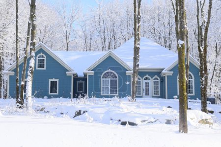 Photo for SHEFFORD QUEBEC CANADA 12 12 2023: Winter landscape and typical canadian house design has long needed to be adapted to Canada's climate and geography - Royalty Free Image