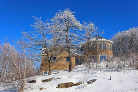 Photo for SHEFFORD, QUEBEC, CANADA - 02 05 2024: Winter landscape and typical canadian house design - Royalty Free Image