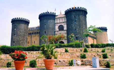 Photo for NAPLES ITALY 05 28 03: Castel Nuovo (New Castle) or Maschio Angioino is a medieval castle located in front of Piazza Municipio and the city hall (Palazzo San Giacomo) in central Naples - Royalty Free Image