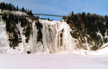Photo for In winter the Montmorency Falls (French: Chute Montmorency) is a large waterfall on the Montmorency River in Quebec, Canada. Cold weather conditions make this area popular with climbers and hikers - Royalty Free Image