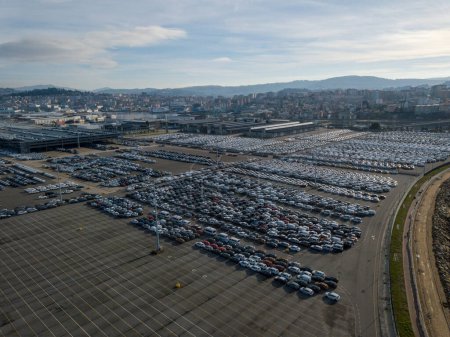 Photo for New cars parked in a parking lot in the port of Vigo to be loaded and shipped all over the world. Cars from the PSA factory in Vigo - Royalty Free Image