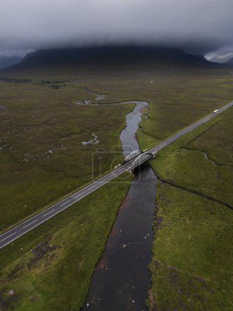 Aerial view of the A82 road and the River Etive and River Etive Bridge at Glencoe, Ballachullish, Scottish Highlands
