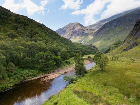 Photo for View of the Water of Nevis river in Glen Nevis and with the Ben Nevis mountain in the background. Scottish highlands - Royalty Free Image