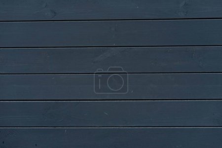 Wooden empty background of graphite color from boards
