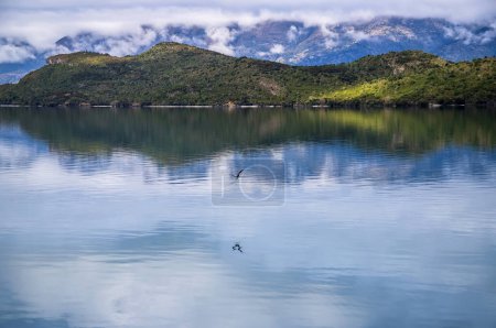 Mountain and reflection, scenic view of Lake Wakatipu, New Zealand, South Island. Beautiful landscape 