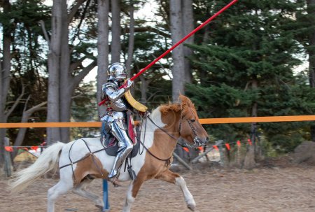 Photo for Paracombe, South Australia - 05.05.2024: Medieval Fair, community entertaining event, knights jousting, skill at arms competitions, and battles with knights in armor horsebask - Royalty Free Image