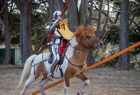 Photo for Paracombe, South Australia - 05.05.2024: Medieval Fair, community entertaining event, knights jousting, skill at arms competitions, and battles with knights in armor horsebask - Royalty Free Image