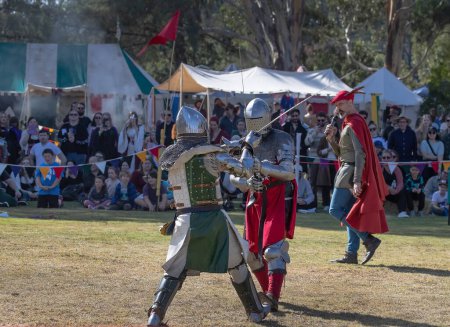 Photo for Paracombe, South Australia - 05.05.2024: Medieval Fair, community entertaining event, knights jousting, skill at arms competitions, and battles with knights in armor on horses, medieval adventure. - Royalty Free Image