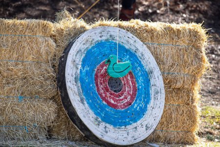 Medieval archery equipment, target for shooting, bow and arrow. Medieval fair. High quality photo
