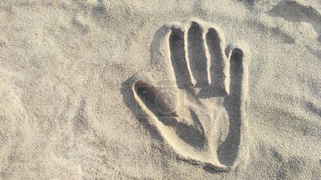 Photo for Background of handprint in sand, copy space. Top view, close-up - Royalty Free Image