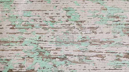 Photo for Wooden surface is covered with old multicolored peeling paint. Top view - Royalty Free Image