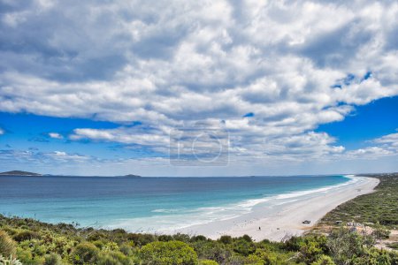 Photo for Clouds seem to mirror the vast expanse of Le Grand Beach, Esperance, Cape Le Grand National Park, Western Australia. In the background islands of the Recherche Archipelago - Royalty Free Image