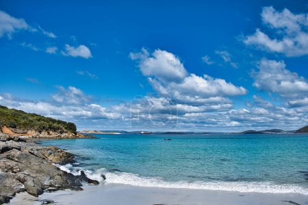Photo for The south coast of the scenic Gull Rock National park, Albany, Western Australia, with a view of King George Sound, under a blue sky with white clouds - Royalty Free Image