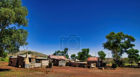 Photo for Panorama of a group of abandoned houses made of corrugated iron in the Western Australian outback. Ghost town of Gwalia, shire of Leonora. - Royalty Free Image
