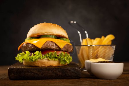 Photo for Burger with french fries. - Royalty Free Image