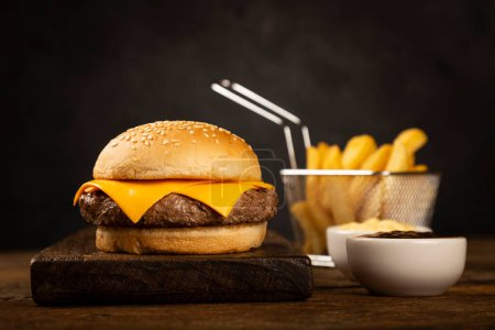 Photo for Cheeseburger with french fries. - Royalty Free Image