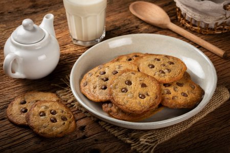 Photo for Delicious chocolate cookies on wooden table. - Royalty Free Image