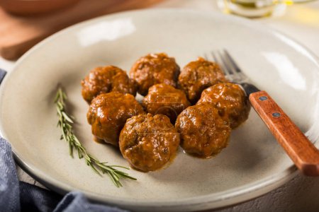 Homemade meatballs roasted on the table.