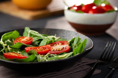 Fresh arugula salad with tomatoes.