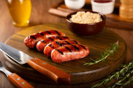 Grilled barbecue sausages on the table.