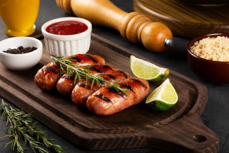 Grilled barbecue sausages on the table.