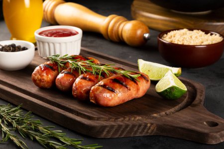 Photo for Grilled barbecue sausages on the table. - Royalty Free Image
