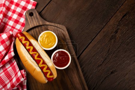 Hot dog with sauces.