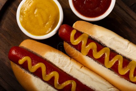 Photo for Hot dog with ketchup and yellow mustard. - Royalty Free Image