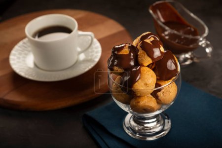 Photo for Delicious profiteroles with chocolate sauce. - Royalty Free Image