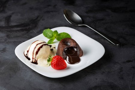 Photo for Petit Gateau dessert with ice cream. - Royalty Free Image